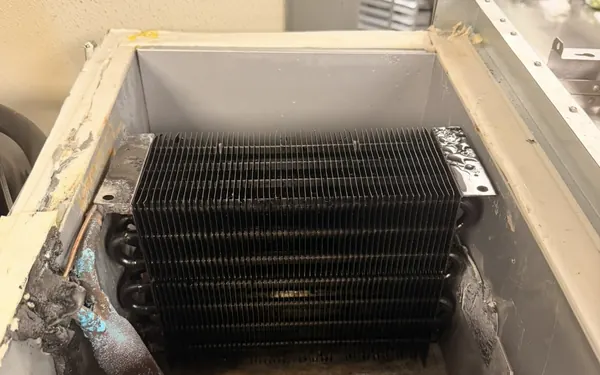 The same evaporator coil after service, clear of ice